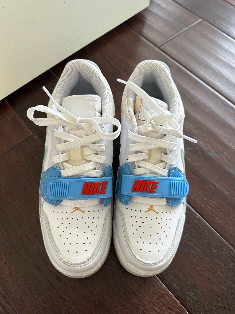 Nike Kids White Sneakers with Blue Strap and Red Logo